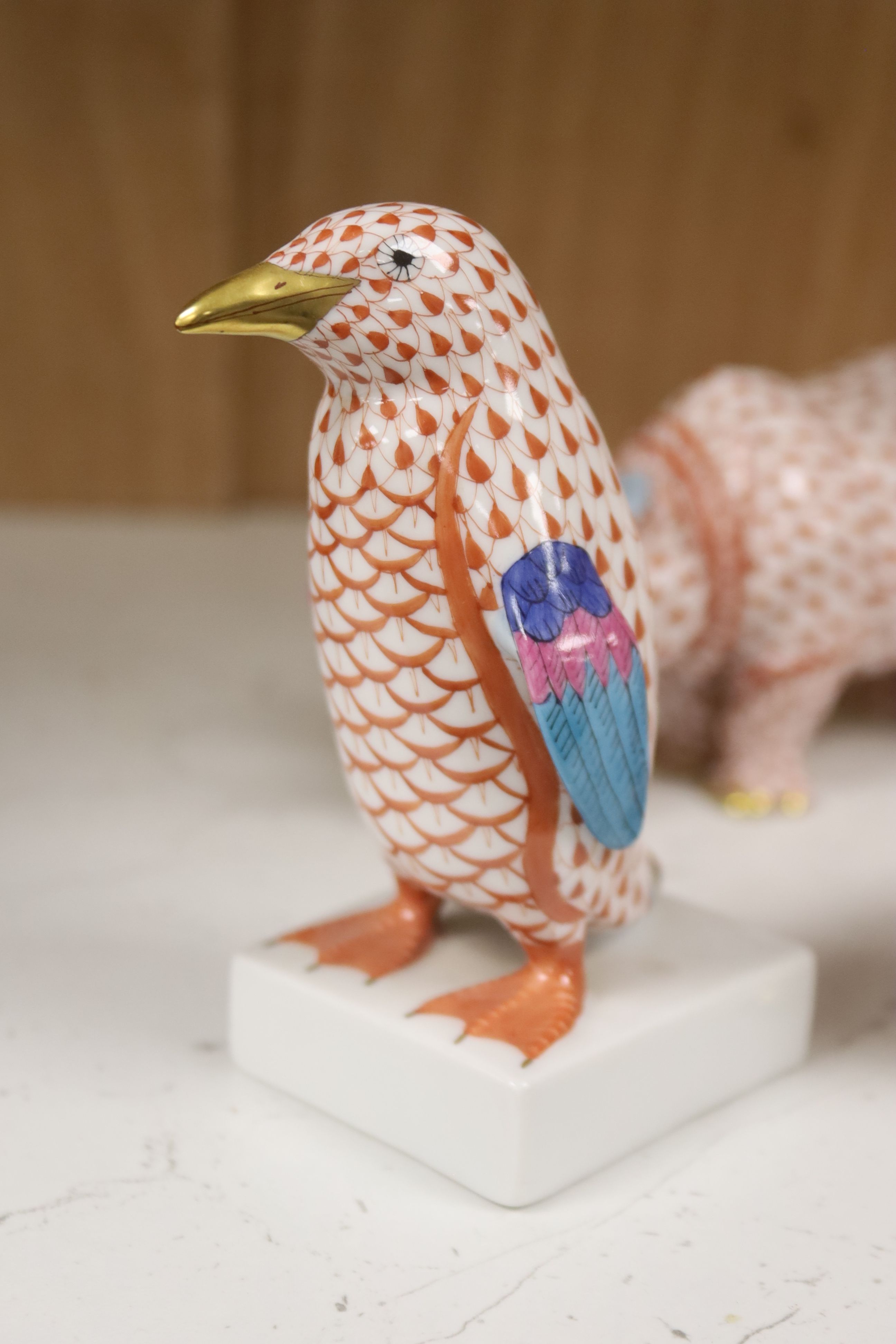 Nine Herend red ‘fishnet’ porcelain animal and bird figures,